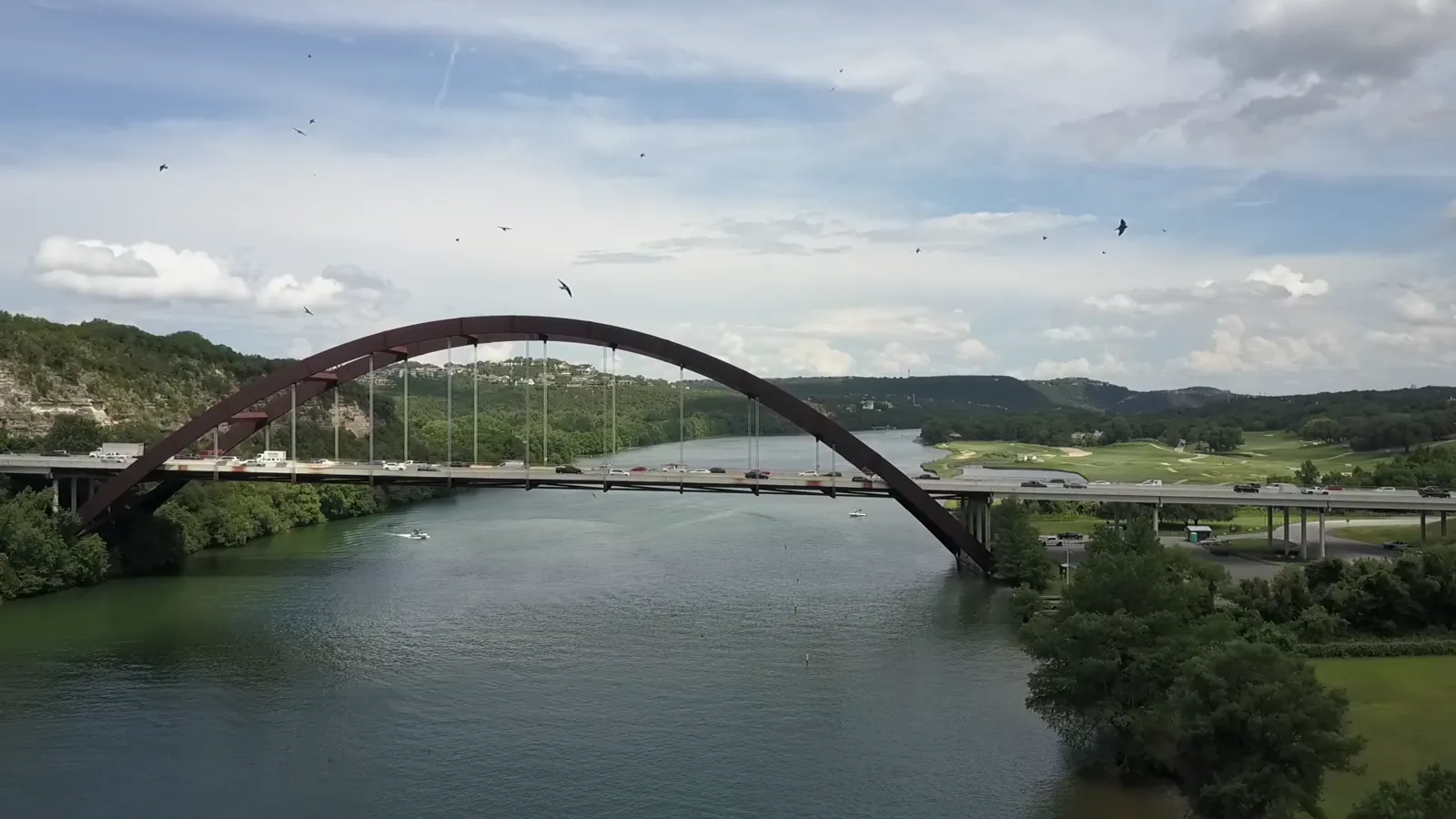 Pennybacker Bridge across Lake Austin, framed by the Central Texas hills